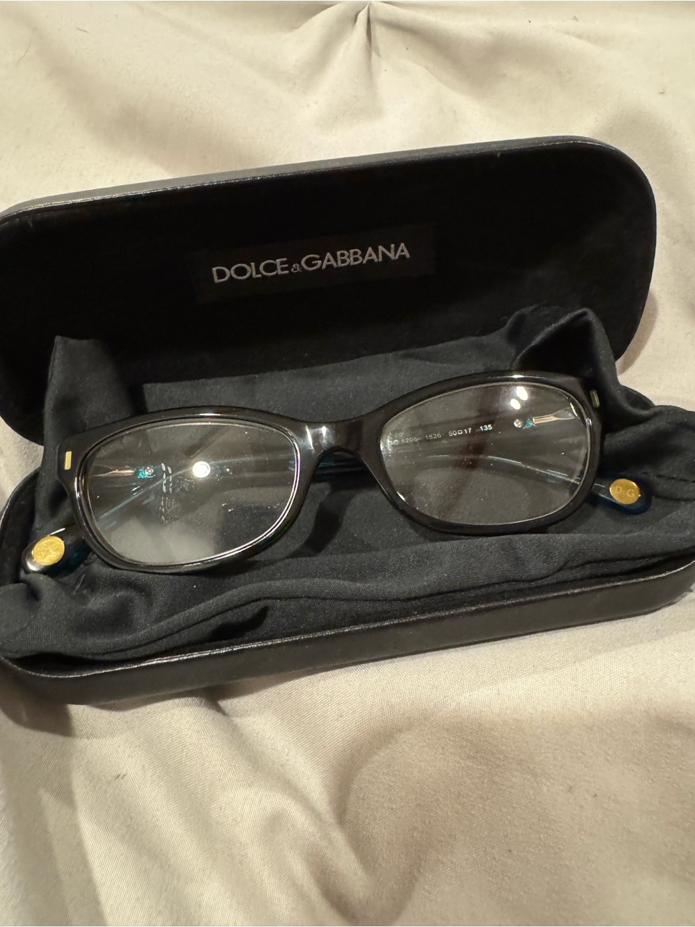 Dolce & Gabbana Black Woman’s Oval-Angled Optical Frames with Teal Accents